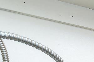 Pinewood Terrace Apartments | Washer and Dryer Hookup close with shelving and water heater.